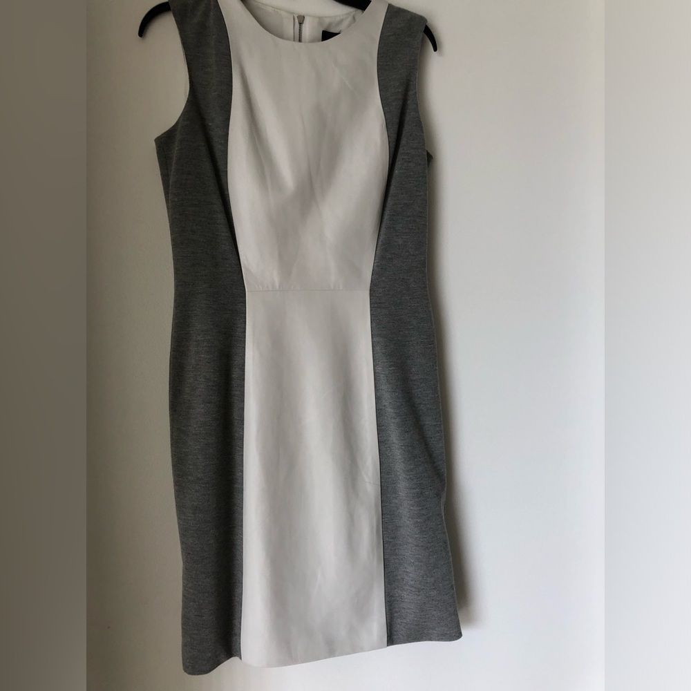 Aqua grey dress with white leather panels.Form fitting.